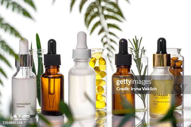 organic, bio cosmetics healthy concept with bottles with natural plants. natural cosmetic products for the care of skin and hair. - almond oil stock-fotos und bilder