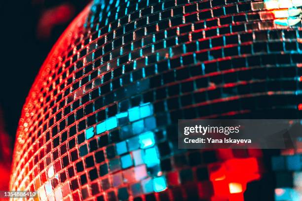 illuminated disco ball in blue and red colors of pop dancing - disco ball bildbanksfoton och bilder