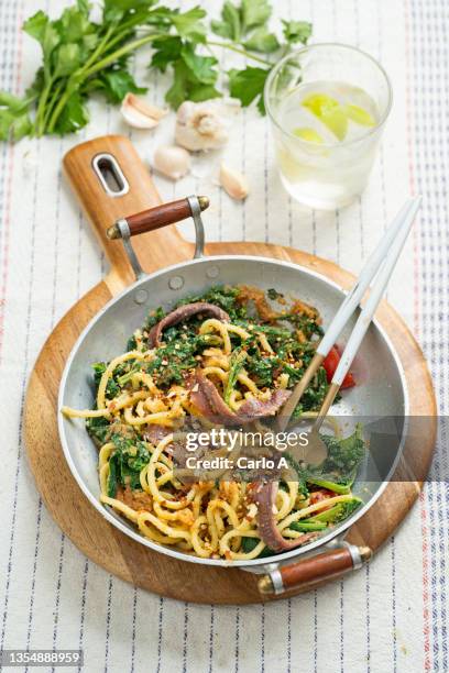 pasta with broccoli rabe and breadcrumbs - anchovy stock pictures, royalty-free photos & images