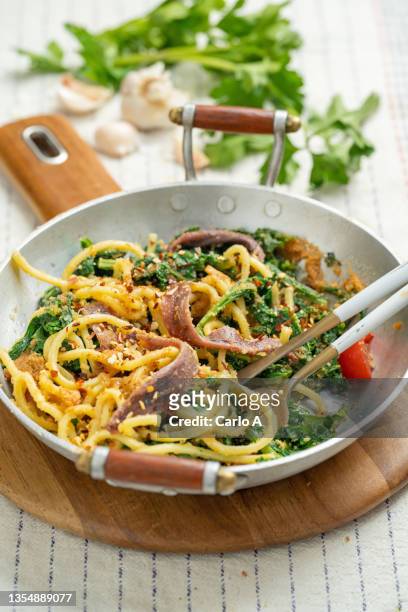 spaghetti  withbroccoli rabe and anchovies - breadcrumb stock pictures, royalty-free photos & images