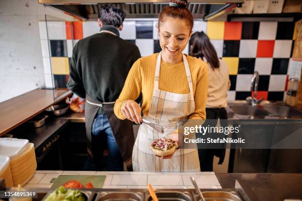 fast food workers - sandwich shop stock pictures, royalty-free photos & images