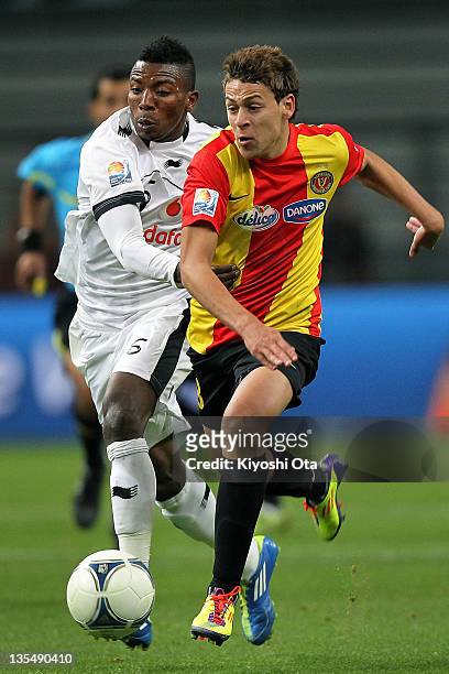 Youssef Msakni of Esperance Sportive de Tunis and Mohammed Kasola of Al-Sadd contest the ball during the FIFA Club World Cup Quarter Final match...