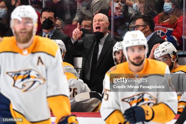 Head coach of the Nashville Predators John Hynes handles bench duties during the second period against the Montreal Canadiens at Centre Bell on...