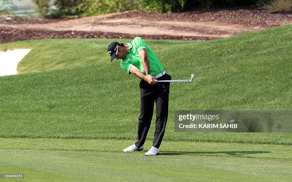 Alvaro Quiros of Spain plays a shot duri