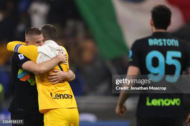 Alessandro Bastoni of FC Internazionale looks on as team mates Samir Handanovic and Milan Skriniar celebrate the 3-2 victory following the final...