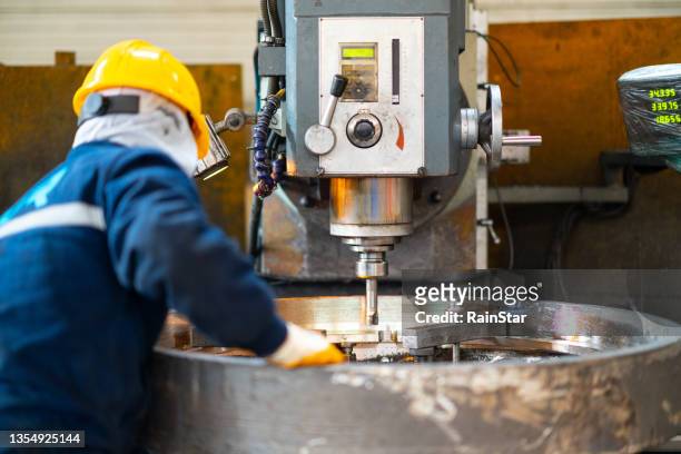 manufacturing worker working inside the factory - milling stock pictures, royalty-free photos & images