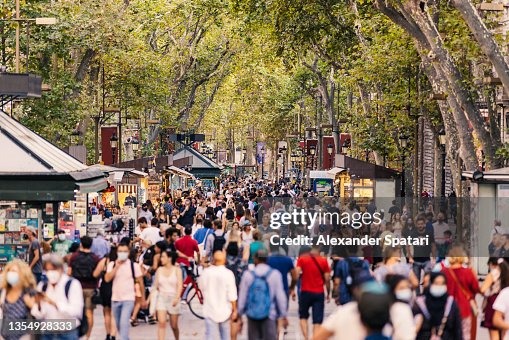 Crowds of tourists walking on La Rambla street in Barcelona, Spain Crowds of tourists walking on La Rambla street in Barcelona, Spain