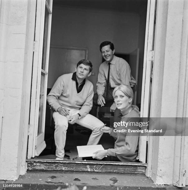Polish-French film director Roman Polanski with producer Gene Gutowski and actress Catherine Deneuve during the filming of 'Repulsion' in London, UK,...