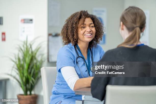 nurse meeting with a patient - teen and doctor stock pictures, royalty-free photos & images