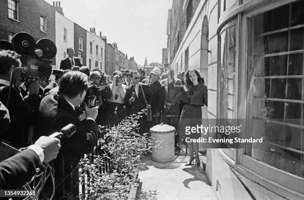 English model Christine Keeler returns to her flat at 30 Linhope Street, London, after being released from prison, UK, 9th June 1964. She had served...