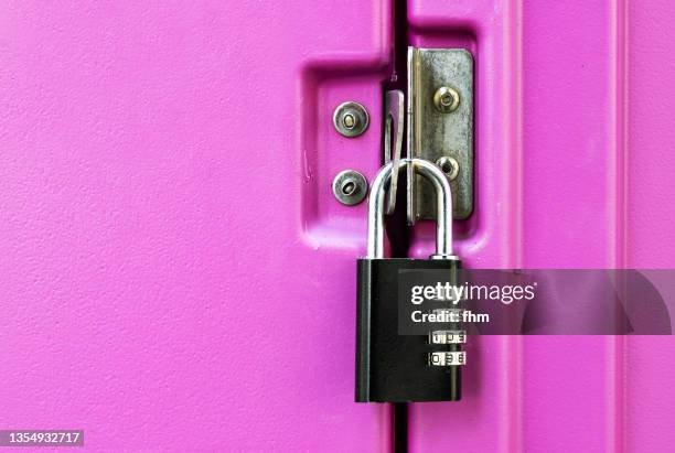 closed door with combination lock - combination padlock stock pictures, royalty-free photos & images