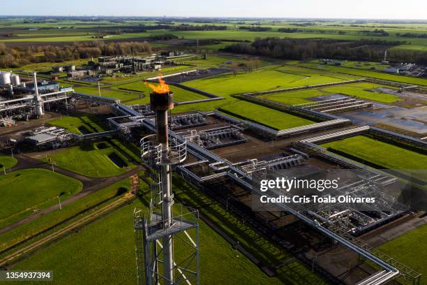 An aerial view of a natural gas extraction plant and pipework above ground at an onshore site operated by Nederlandse Aardolie Maatschappij BV on...
