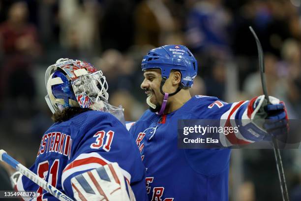 Igor Shesterkin of the New York Rangers is congratulated by teammate Ryan Reaves after the game against the Buffalo Sabres at Madison Square Garden...