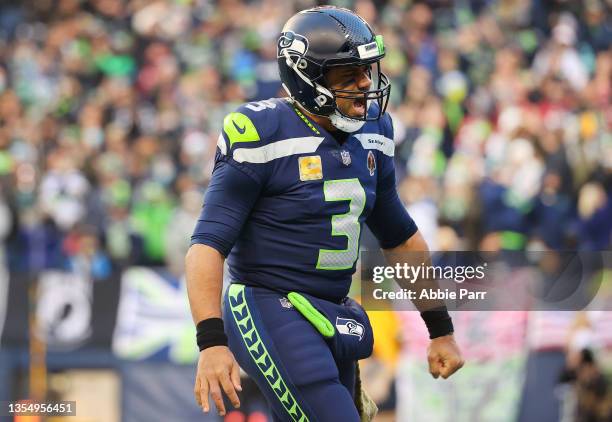 Russell Wilson of the Seattle Seahawks celebrates after a Seattle touchdown during the fourth quarter against the Arizona Cardinals at Lumen Field on...