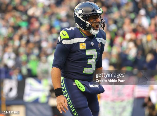 Russell Wilson of the Seattle Seahawks celebrates after a Seattle touchdown during the fourth quarter against the Arizona Cardinals at Lumen Field on...