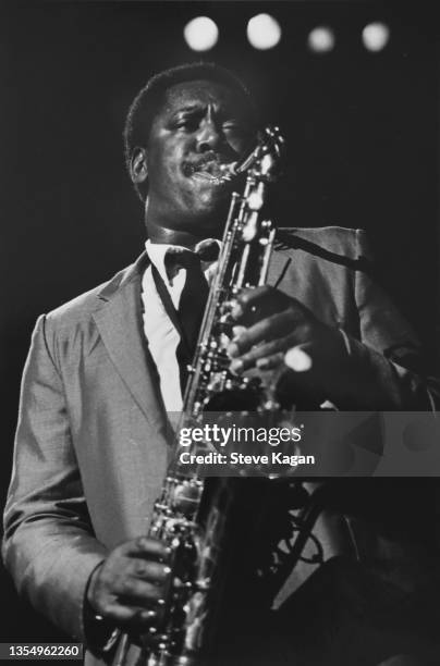 American Rock musician Clarence Clemons plays saxophone as he performs onstage at the Uptown Theatre, Chicago, Illinois, October 10 or 11, 1980. As...