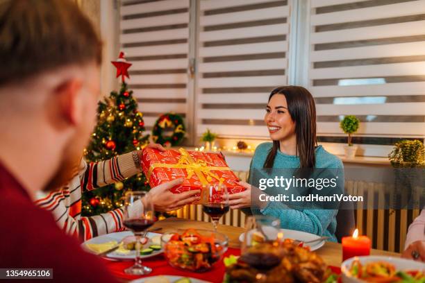 exchanging christmas gifts - exchanging gifts stock pictures, royalty-free photos & images