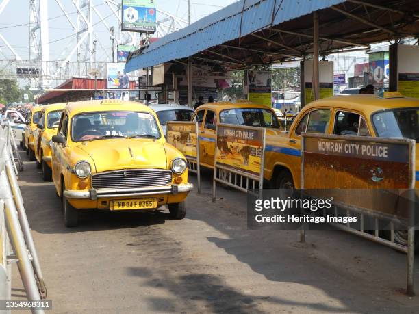 Taxi cabs in Howrah City, West Bengal, India, 2019. Artist Unknown.
