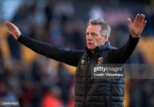 First team coach Stuart Pearce helps warm the players up before the Premier League match between Wolverhampton Wanderers and West Ham United at...