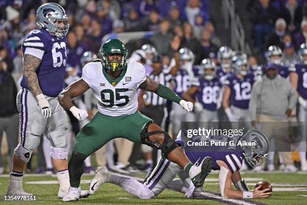 Defensive lineman Gabe Hall of the Baylor Bears celebrates after sacking quarterback Skylar Thompson of the Kansas State Wildcats, during the second...