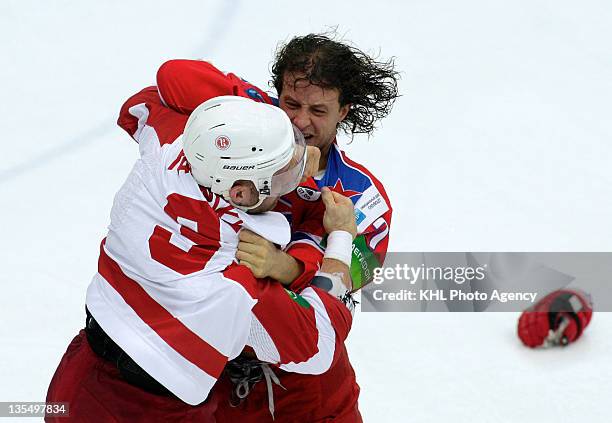 Jeremy Yablonski of the Vityaz and Darsy Verot tangled up as they fight during the game between Vityaz Chekhov and CSKA Moscow during the KHL...