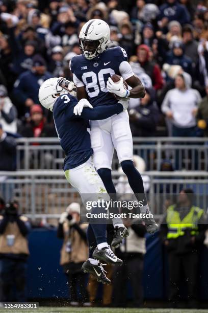 Malick Meiga of the Penn State Nittany Lions celebrates with Parker Washington after catching a pass for a touchdown against the Rutgers Scarlet...