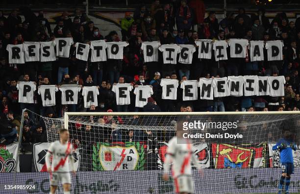 Rayo Vallecano supporters hold up shirts with a message which reads 'Respect and Dignity for their Women's team' during the La Liga Santander match...