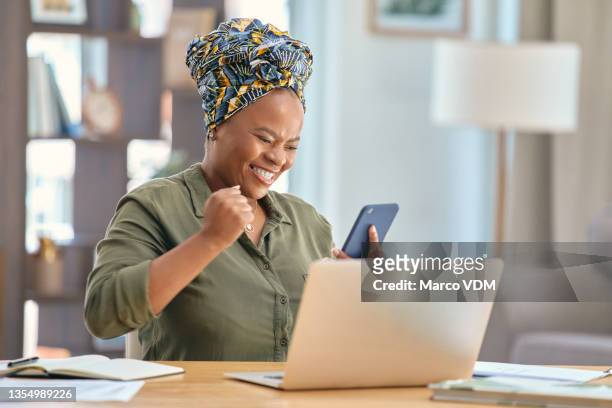 shot of a businesswoman looking at her smartphone after receiving good news - excitement laptop stock pictures, royalty-free photos & images