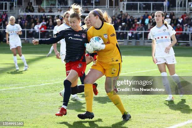 Emily Sonnett of Washington Spirit reaches for a corner kick caught by Cassie Miller of Chicago Red Stars during the NWSL Championship held at Lynn...