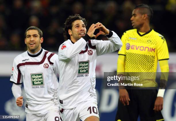 Olcay Sahan of Kaiserslautern celebrates after he scores his team's equalizing goal during the Bundesliga match between Borussia Dortmund and 1. FC...