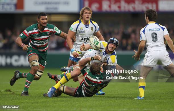 Julien Bonnaire of Clermont Auvergne is tackled by Tom Croft during the Heineken Cup match between ASM Clermont Auvergne and Leicester Tigers at...