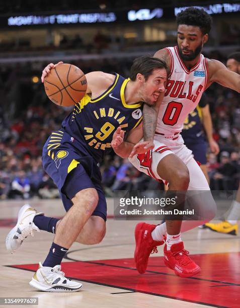 McConnell of the Indiana Pacers drives against Coby White of the Chicago Bulls at the United Center on November 22, 2021 in Chicago, Illinois. NOTE...