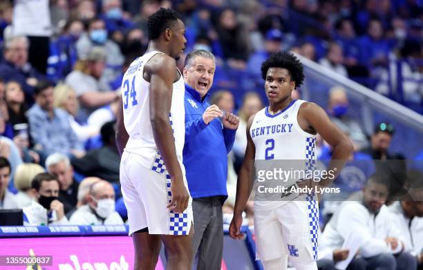 John Calipari the head coach of the Kentucky Wildcats gives instructions to Oscar Tshiebwe and Sahvir Wheeler during the game against the Albany...