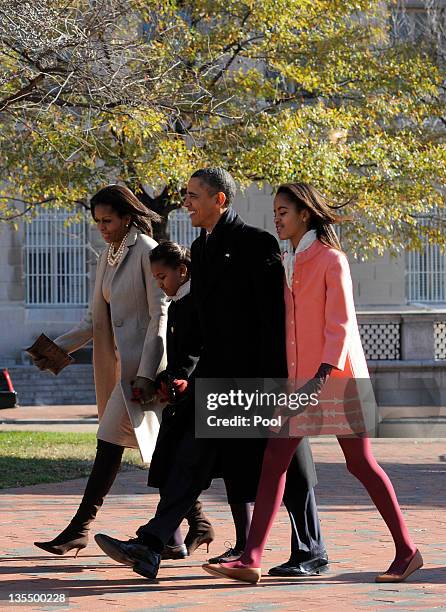 President Barack Obama, first lady Michelle Obama and daughters Malia Obama and Sasha Obama walk from the White House across Lafayette Park to St....