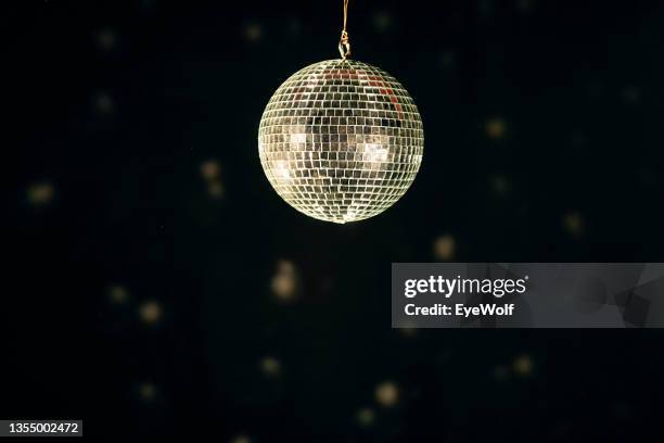 close up disco ball against a dark background with copy space - mirror ball stock pictures, royalty-free photos & images