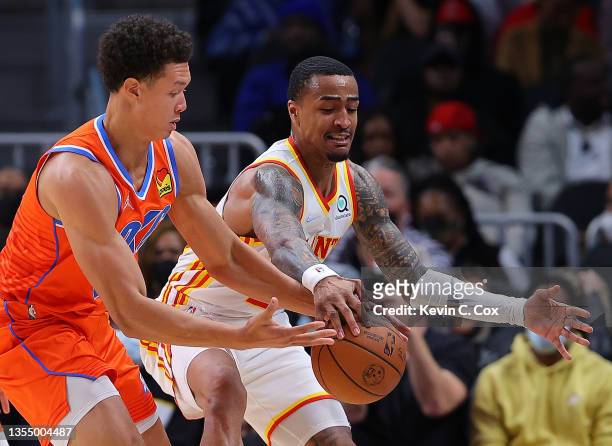 Isaiah Roby of the Oklahoma City Thunder steals the ball away from John Collins of the Atlanta Hawks during the second half at State Farm Arena on...