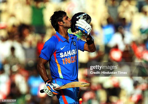 Manoj Tiwary of India kisses his helmet after reaching his half-century during the 5th One Day International between India and West Indies at the...
