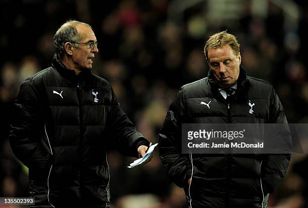 Tottenham Hotspur Assistant Manager Joe Jordan speaks to Manager Harry Redknapp during the Barclays Premier League match between Stoke City and...