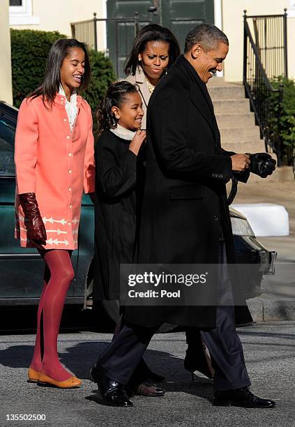 President Barack Obama, first lady Michelle Obama and daughters Malia Obama and Sasha Obama walk from St. John's Church to the White House after...