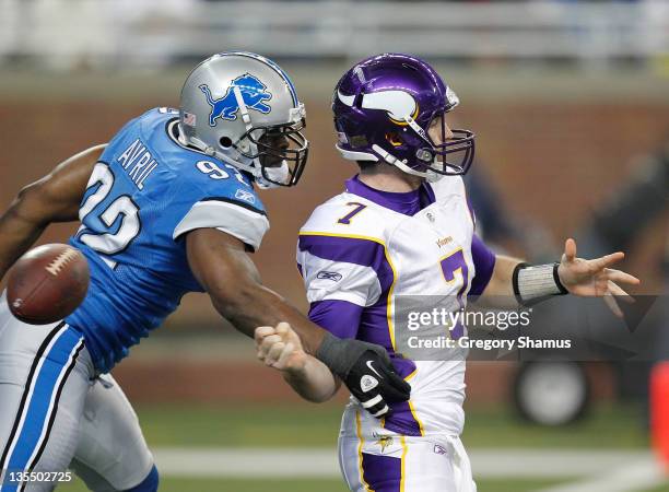 Cliff Avril of the Detroit Lions causes a first quarter fumble against Christian Ponder of the Minnesota Vikings that ended up being recovered in the...