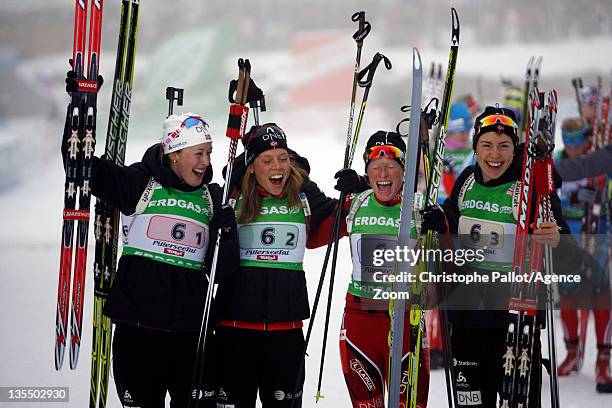 Fanny Welle-Strand Horn of Norway, Elise Ringen of Norway, Synnoeve Solemdal of Norway, Tora Berger of Norway celebrate taking first place the IBU...