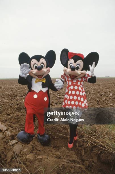 Mickey Mouse and Minnie Mouse visit the site of the future Disneyland in Marne La Vallee.