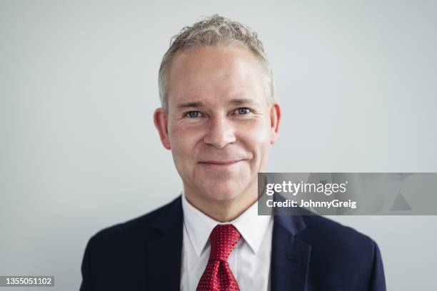 indoor portrait of cheerful businessman in corporate attire - skjorta och slips bildbanksfoton och bilder