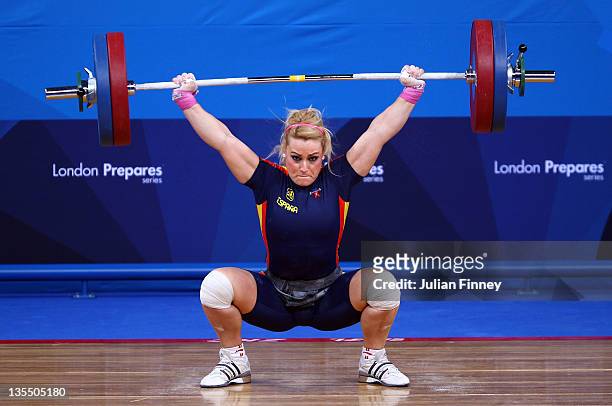Lidia Valentin of Spain makes a lift in the Women's 75kg during the Weightlifting LOCOG Test Event for London 2012 at ExCel on December 11, 2011 in...