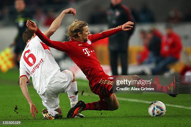 Anatoliy Tymoshchuk of Muenchen is challenged by Georg Niedermeier of Stuttgart during the Bundesliga match between VfB Stuttgart and FC Bayern...