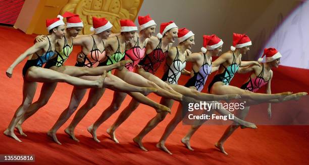 The United States team perform the dance as wearing Christmas hats before the Synchronized Swimming Free Combination Final during day three of the...