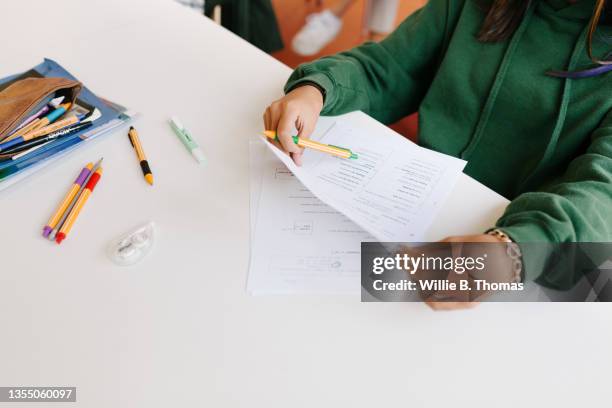 high school student proof reading exam answers - exam photos et images de collection