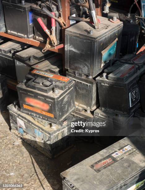 heap of used automobile batteries - greece - car battery stock pictures, royalty-free photos & images
