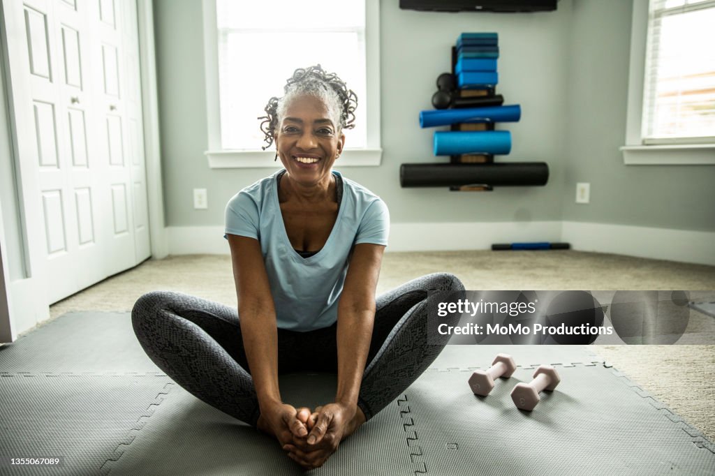 Senior woman exercising in home gym