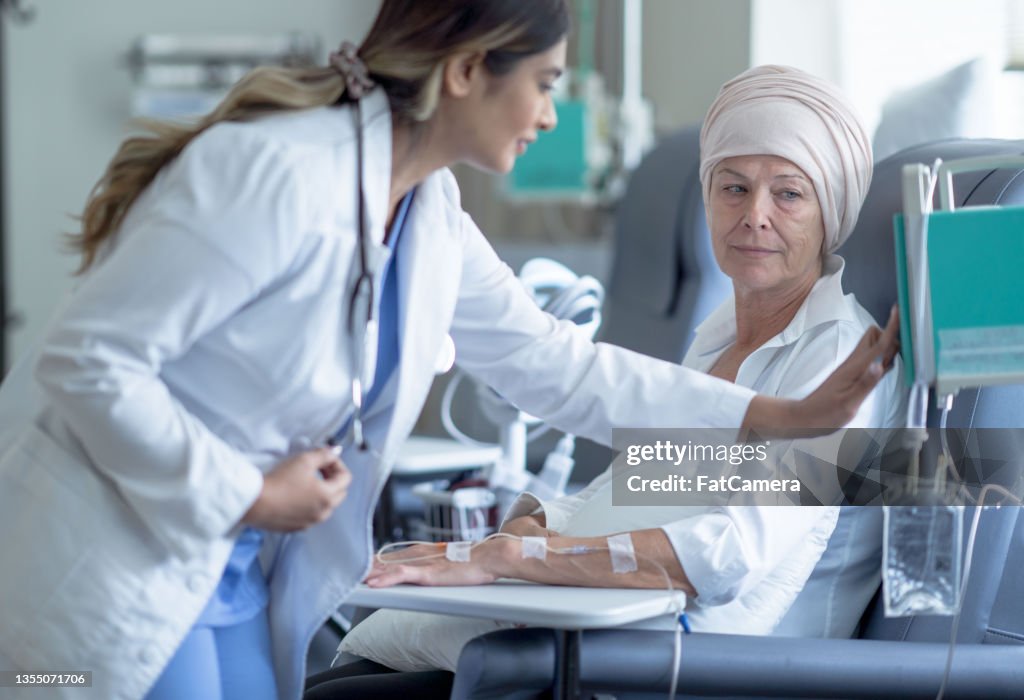 Doctor Changing a Chemotherapy Dosage